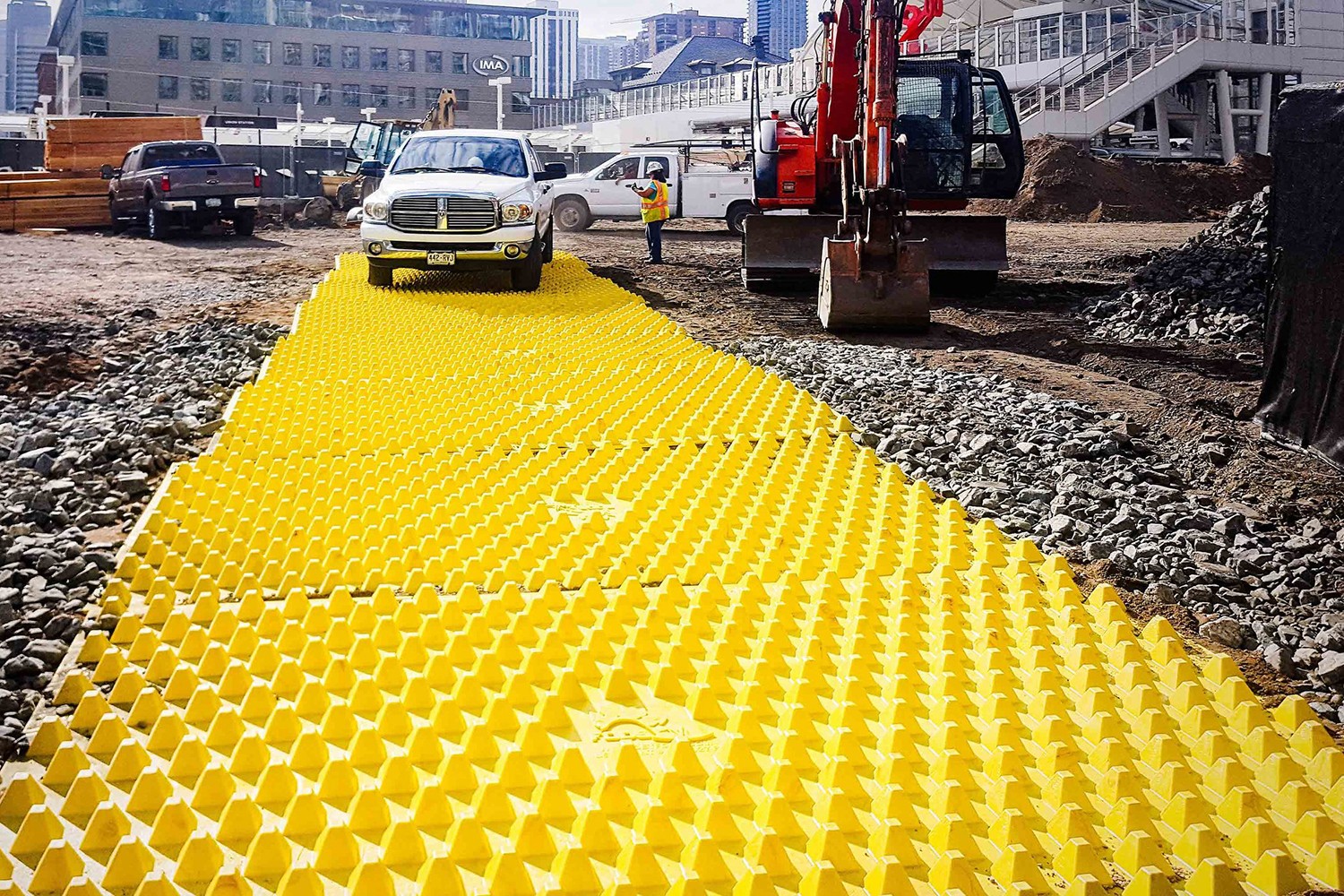 Picture of FODS Trackout Mats deployed for mud and dirt removal on construction site entrances and exits