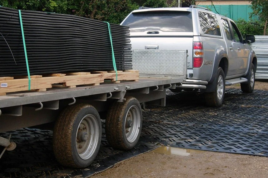 Truck driving over DuraDeck mats