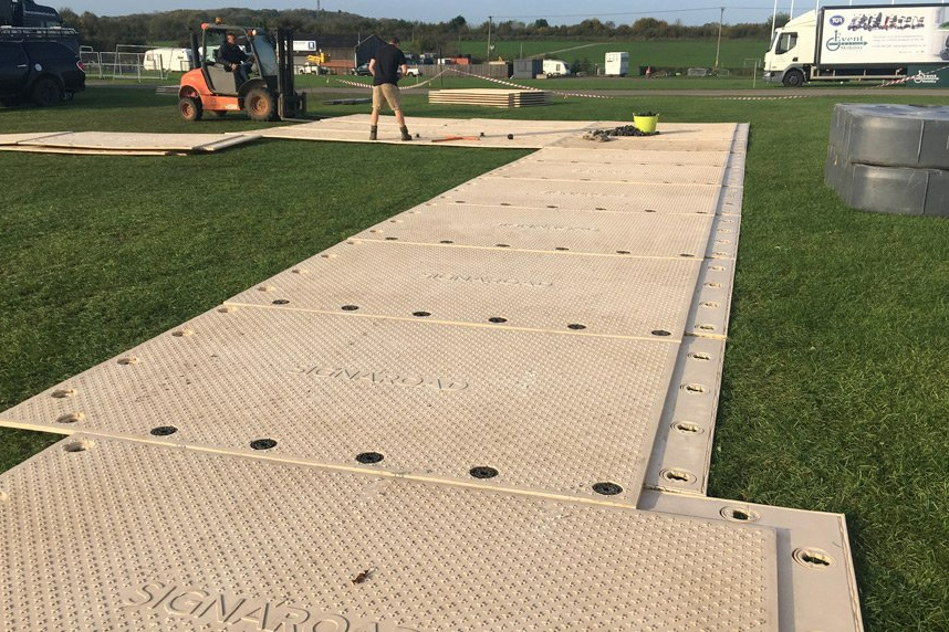 SignaRoad mats being assembled in a field