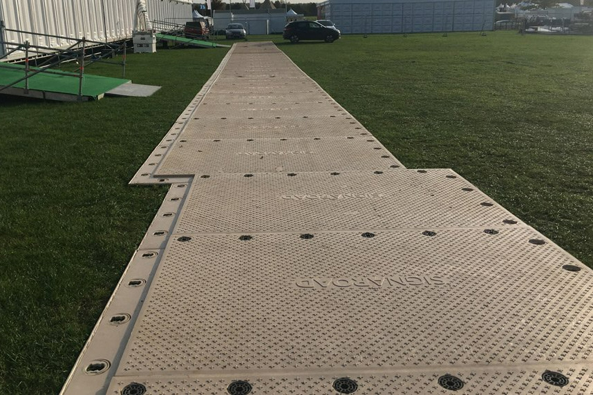 SignaRoad Mats forming a road in a field