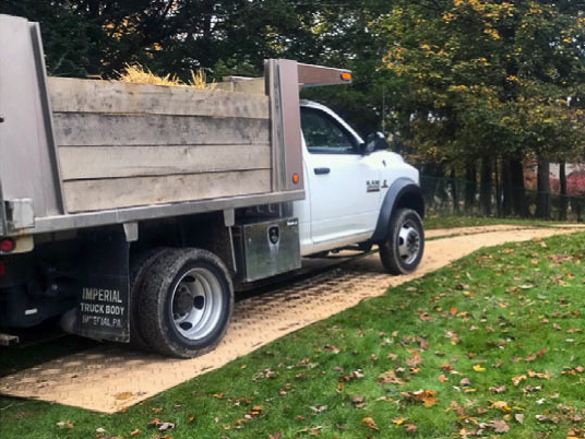 Truck driving over Ground Protection Scout Mats