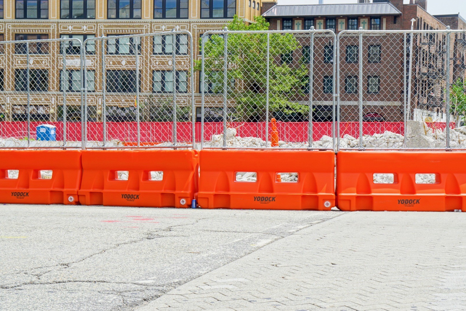 Image of Yodock barrier in use with fence installed